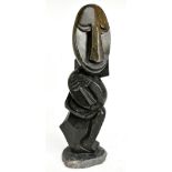 SHONA ISLAND; large 20th century carved sculpture representing a seated figure, indistinctly