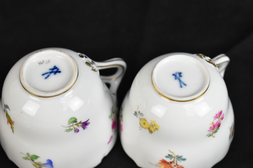 MEISSEN; a harlequin set of five porcelain cups and saucers, each decorated with floral sprigs under - Image 9 of 16