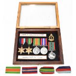 A WWII Prisoner of War medal group of four comprising War and Defence Medals, 1939-1945 and