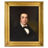 EARLY 19TH CENTURY: oil on canvas portrait of a gentleman wearing a black jacket and bow tie,