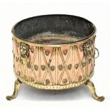 A large and impressive country house size copper and brass log bin modelled as a drum, mounted