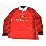 ERIC CANTONA; an Umbro Manchester United 1994-96 seasons retro reproduction home shirt signed