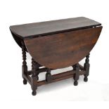 A Queen Anne oak drop-leaf gateleg table, on bobbin turned and block stretchered supports, height