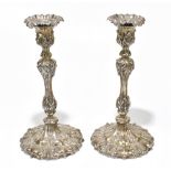 ***WITHDRAWN*** W&G SISSONS; a pair of Victorian hallmarked silver candlesticks of relief foliate