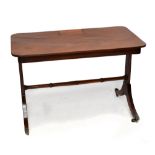 A regency mahogany desk in the manner of Gillows of Lancaster, the rounded rectangular top with