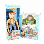 TOY STORY; two boxed Disney Toy Story figures, Buzz Lightyear and Woody.