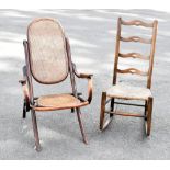 A late Victorian stained and steamed beech folding chair with caned back and seats, together with