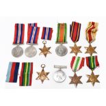 A WWII group of six including War & Defence Medals, Pacific, Burma, Italy and Africa Stars