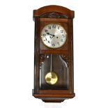 A 1930s oak and stained beech regulator type wall clock, with silvered Arabic numeral dial, length