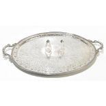 A large twin handled silver plated oval tray with floral detail, 77.5 x 50cm, and a salt and