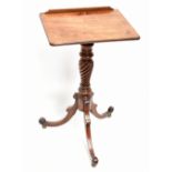 An early 19th century mahogany adjustable reading table, on turned and tripod supports, top measures