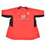 DAVID BECKHAM; a Nike Manchester United 2002-03 home shirt signed with ‘Beckham 7’ to reverse, size