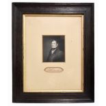 ROBERT OWEN (1771-1858); an autograph framed with a photograph of Owen, 9.5 x 7.5cm, in an oak