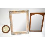 A gilt gesso framed mirror, 76 x 61cm, a smaller bevelled mirrored panel, 66 x 44.5cm, and a small