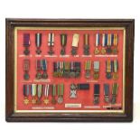 A group of medal miniatures including The Victoria Cross, The Military Cross, The Crimea, South