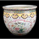 A late 19th/early 20th century Famille Rose porcelain jardinière decorated with shaped cartouches