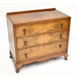 A 1930’s walnut chest, with three long drawers, on cabriole legs, height. 81cm, width 92cm, depth