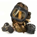 An unusual purportedly child's gas mask, dated 1939, length 45cm, and two further standard adults