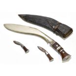 A Gurkha kukri knife, with 32cm blade in leather scabbard with two smaller knives, overall length