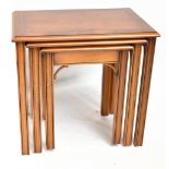 A modern walnut nest of three tables, on moulded and chamfered legs, height 53cm, width 56cm,