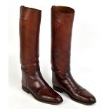 A pair of tan leather riding boots, height 47cm, length of sole 29.5cm. Additional