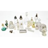 A collection of cut and pressed glass scent bottles, toilet jars, knife rests etc, including two