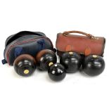 Two pairs of Crown Green bowling balls with ivory inset discs. Additional InformationPostage for