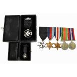 A WWII St John's Ambulance medal group of four comprising War and Defence Medals, 1939-1945,