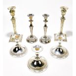 A pair of Edwardian Adam style silver plated candlesticks decorated with floral swags, height