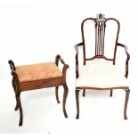 An Edwardian line inlaid mahogany armchair with pierced floral back, raised on cabriole supports