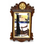 A Chippendale-style fretwork wall mirror with gilt detail and bevelled glass, 70 x 42cm.Additional