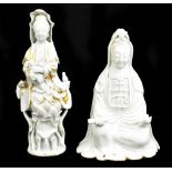 A 19th century Chinese porcelain blanc-de-chine figure of Guanyin, together with a similar blanc-