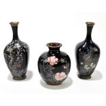 Two Japanese cloisonné vases of square form with flared necks, each with floral decoration on a blue