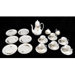 A Rosenthal nineteen piece coffee service, with moulded detailing and gilt with floral sprigs and