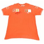 MICHAEL SCHUMACHER; a Fila Ferrari official team shirt with embroidered logos signed to front, size