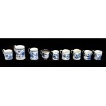Nine 18th century Chinese blue and white porcelain mugs including a cylindrical example with