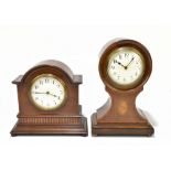 Two Edwardian inlaid mahogany mantel clocks, the balloon shaped example set with enamel Roman