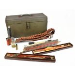 A mixed group including a Webley target launcher, two cartridge/ammunition belts, gun cleaning kit
