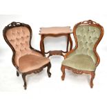 Two mid-20th century carved mahogany framed spoon back nursing chairs, each with button back