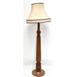 A late 19th century mahogany standard lamp with fluted column, height 156cm.