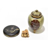 An early 20th century cloisonne enamel and brass mounted lidded jar on three splayed feet, height