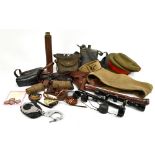 A collection of WWII and later leather and canvas military accessories including two tan leather gun