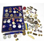 A mixed group of medals and badges including a WWI War Medal awarded to 154321 Cpl. E.P. Cross A.S.