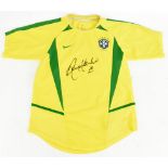 RONALDINHO (Ronaldo de Assis Moreira); a Nike Brazil 2002 child’s home shirt signed to front.