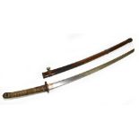 A WWII Japanese Samurai/Katana sword, with bronze tsuba with floral detail and shagreen leather