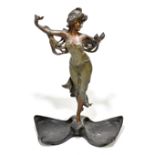 An Art Nouveau-style bronze figure representing a maiden with outswept arms and flowing hair, raised