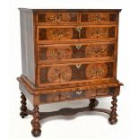 A William and Mary walnut marquetry and laburnum oyster veneered chest on stand, with two short