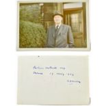 LAURENCE STEPHEN LOWRY; inscribed and signed colour photograph of the artist standing outside his