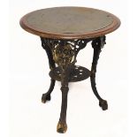A reproduction Britannia style pub table, with circular mahogany framed top, raised on cast iron