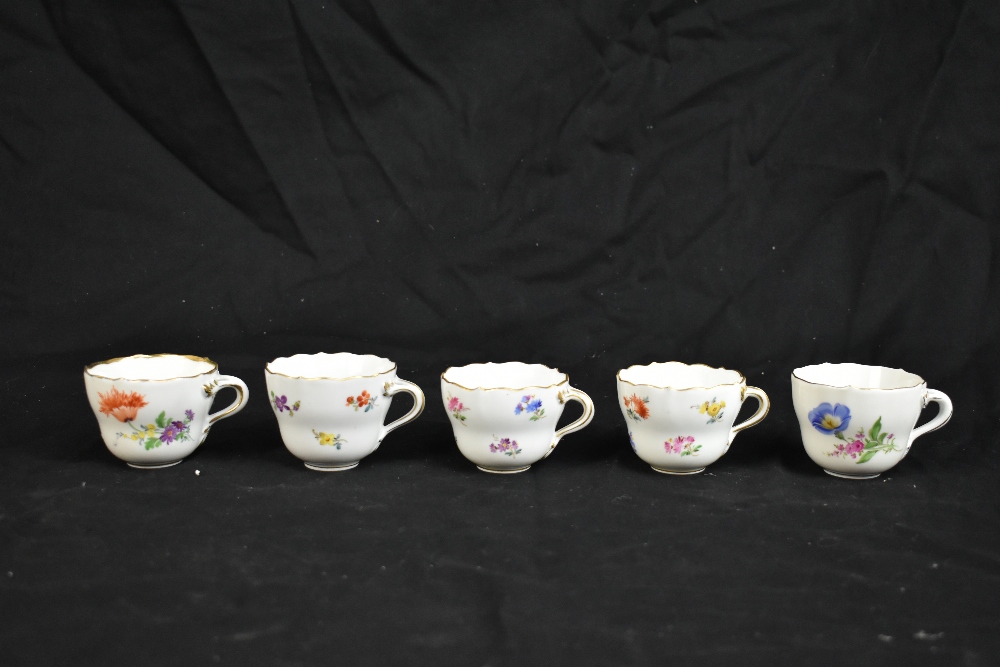 MEISSEN; a harlequin set of five porcelain cups and saucers, each decorated with floral sprigs under - Image 3 of 16